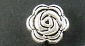 ¤artnr. öpbs Silver blomma i metall. 8x4mm. 1mm hål